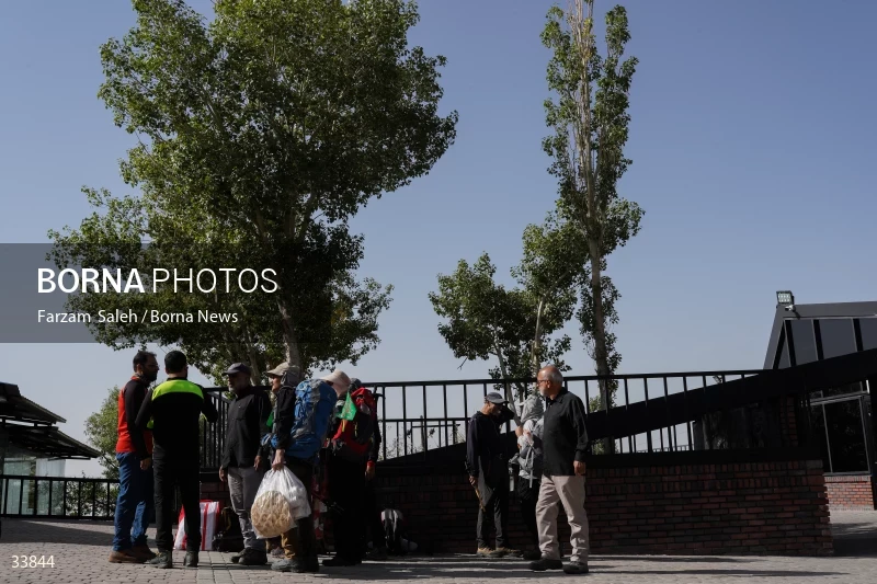 Climbing Tochal Peak with the flag of Imam Hossein (AS)
