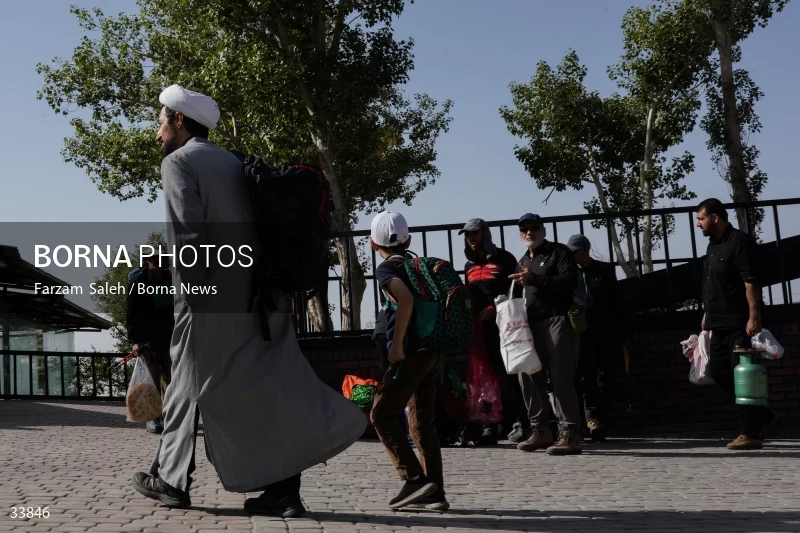 Climbing Tochal Peak with the flag of Imam Hossein (AS)