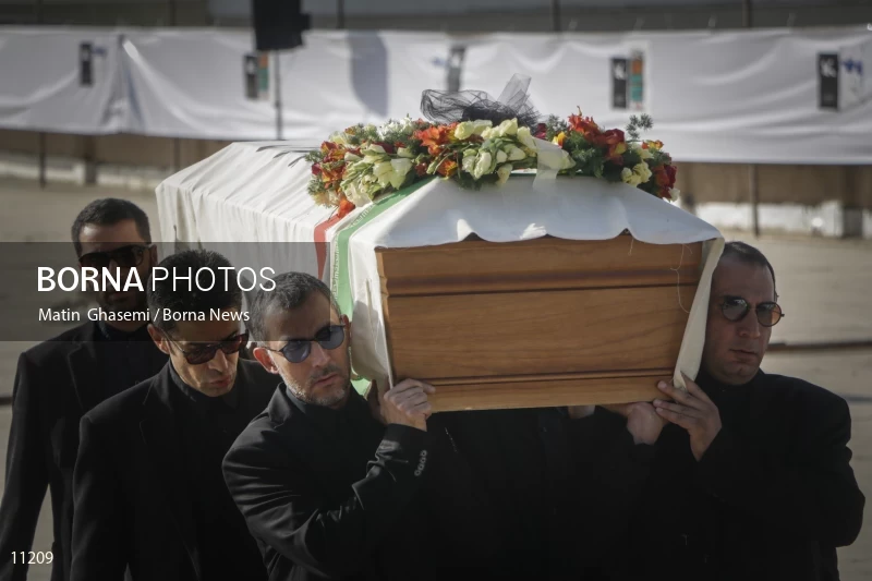 Mourners carry the coffin of Abbas Kiarostami
